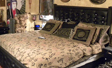 Finished bed with texture black powder coat and custom leather with skulls head and foot board.