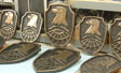 Bronze coating backward sprayed into molds and backed with fiberglass. Speed polish and black patina.